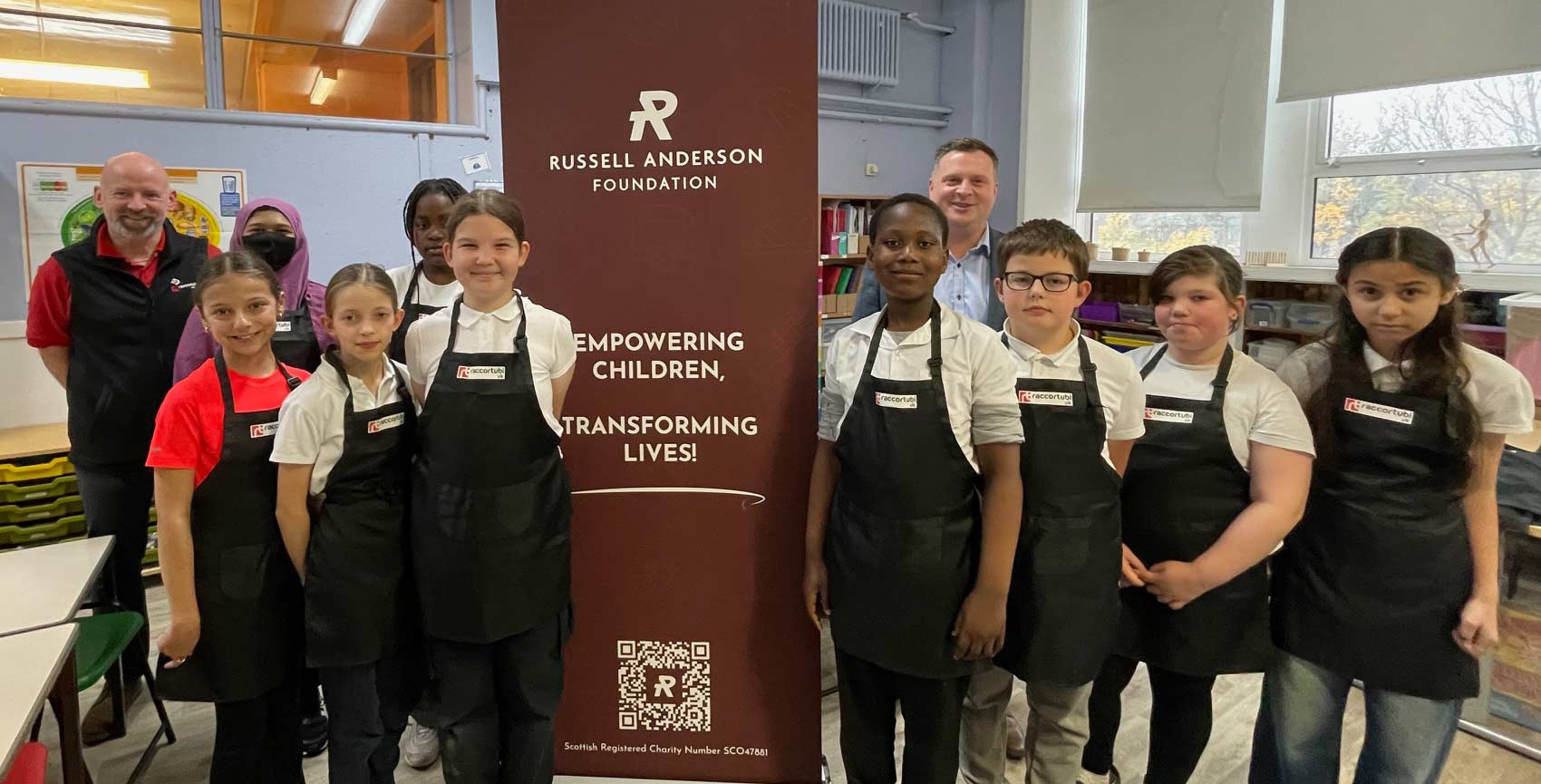 An image of Andy Troup and John Kidd from Raccortubi with the children at the Skills Hub